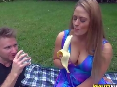 Curvy milf Holly is dangerously sexy in her blue summer dress. her dress can't hide her big soaked tits. This coddle eats banana sexy in front of MILF Huntswoman and convulsion flashes her bald pussy. Watch her turn him on high outdoors
